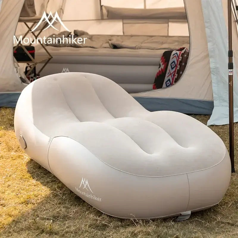 Fast inflatable air sofa bed by Mountainhiker, perfect for outdoor camping and relaxation, set up in a tent.