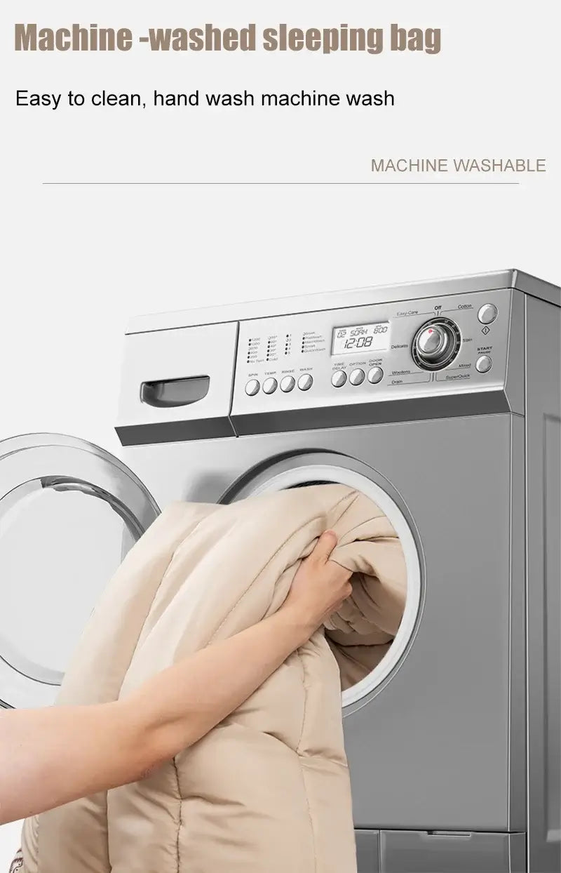 Hand inserting a machine-washable sleeping bag into a washing machine for easy cleaning.