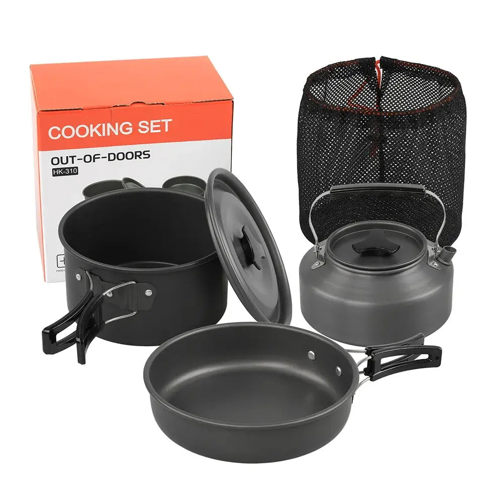 Camping cookware set including pot, frying pan, and kettle in a mesh storage bag, ideal for outdoor cooking.