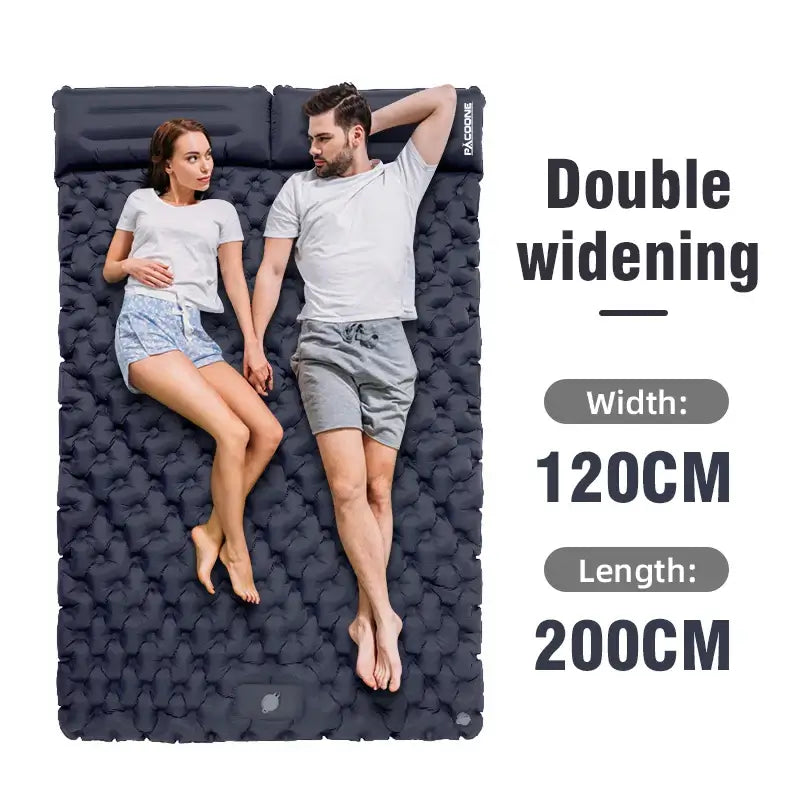 Outdoor camping double inflatable mattress showing two people comfortably lying on an extra wide sleeping pad.