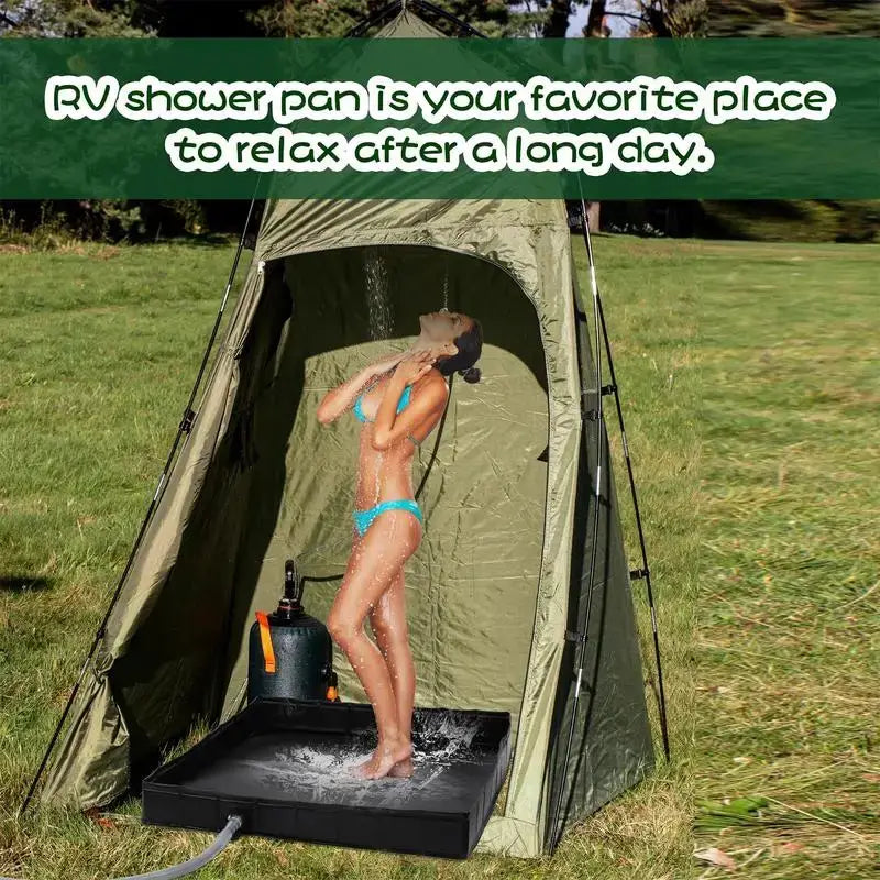 Woman enjoying a shower in a portable camping tent with a waterproof shower base outdoors.