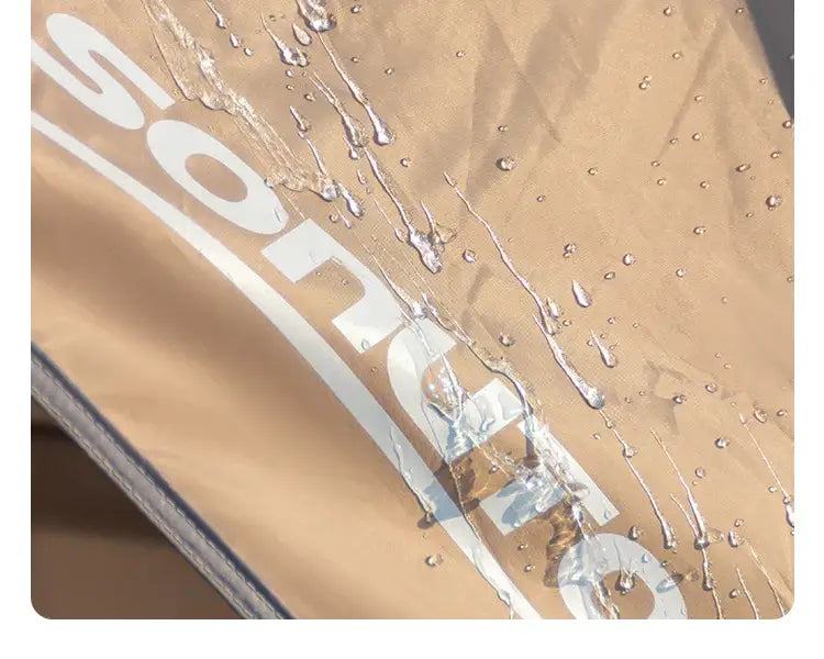 Water droplets on the waterproof fabric of an outdoor camping tent, showcasing durability and weather resistance.