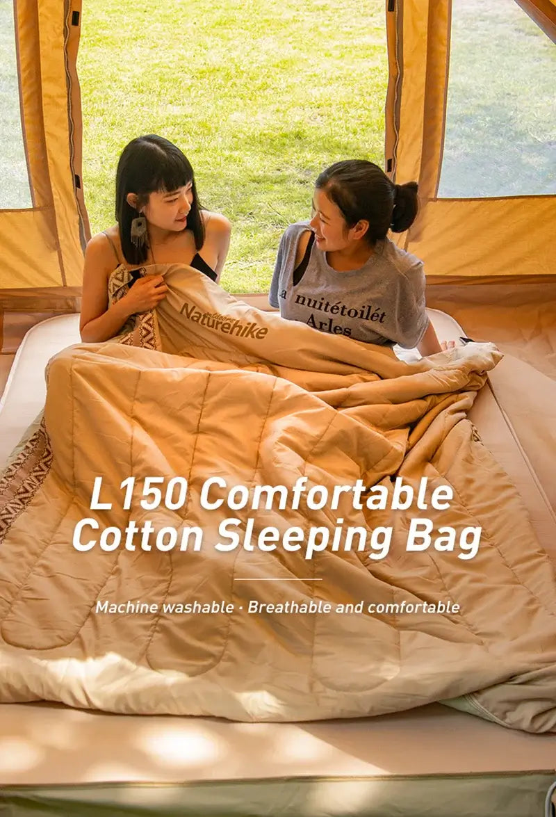 Two people enjoying the Naturehike L150 cotton sleeping bag, showcasing its comfort and breathable design in a cozy tent setting.